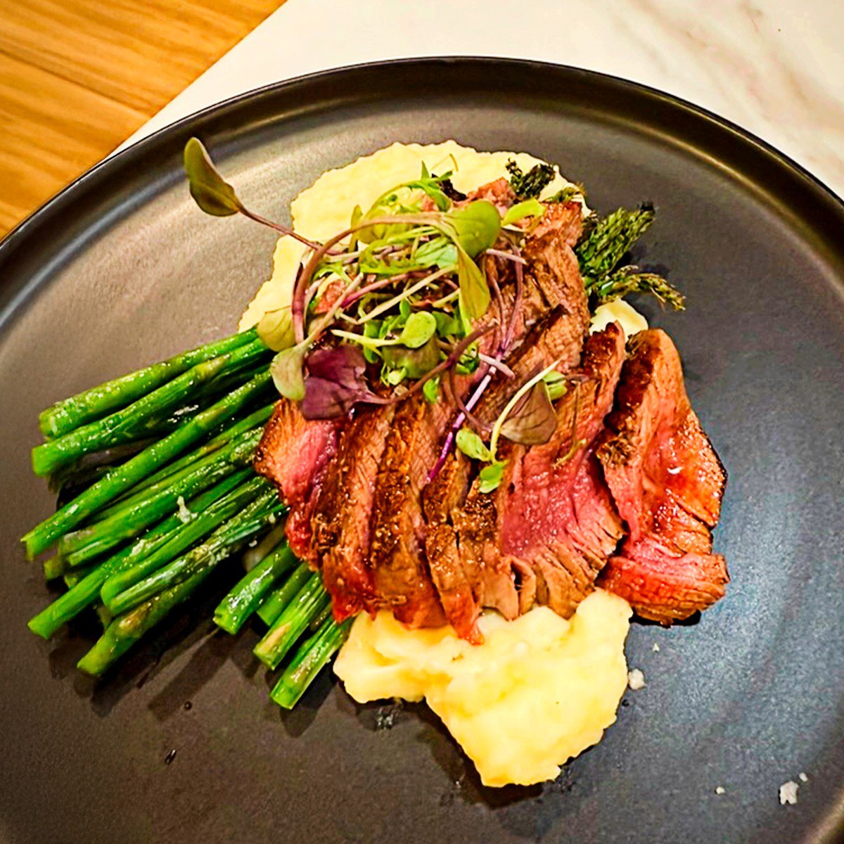Seared steak with asparagus over puree
