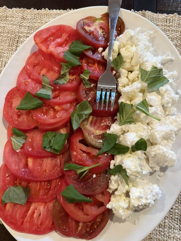 Tomato and burrata platter with basil